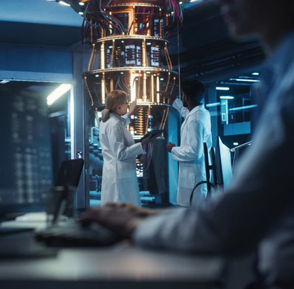 Female and Male Engineers Working in an Advanced Lab